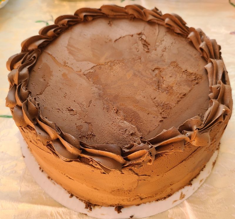 A chocolate dobash cake frosted with chocolate frosting.