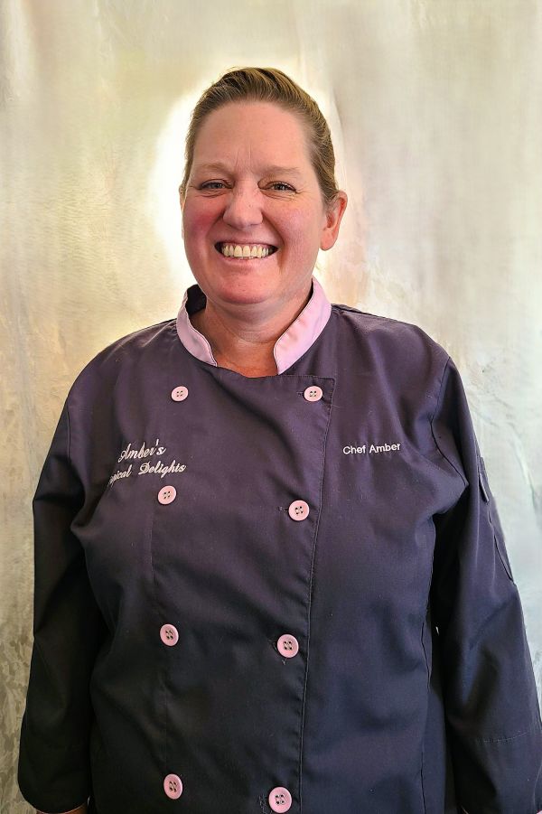Our wonderful baker pastry chef, Amber, standing in uniform.